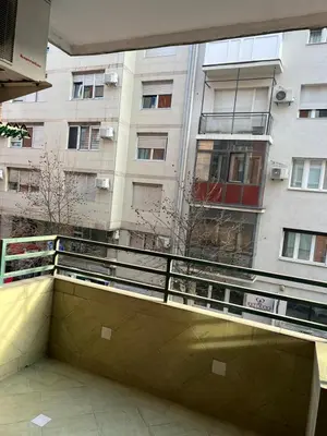 a balcony in front of a tall building at Tesla Lux Apartman in Belgrade