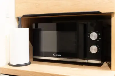 a microwave oven sitting on top of a shelf at Luxury Apartment Old Town City Center in Belgrade