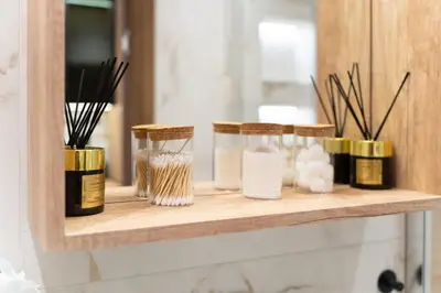 a shelf with three glass jars on top of it at Luxury Apartment Old Town City Center in Belgrade