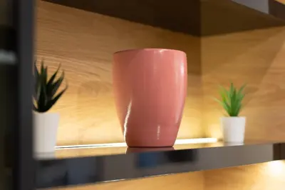 a pink vase sitting on a shelf with two plants at Luxury Apartment Old Town City Center in Belgrade