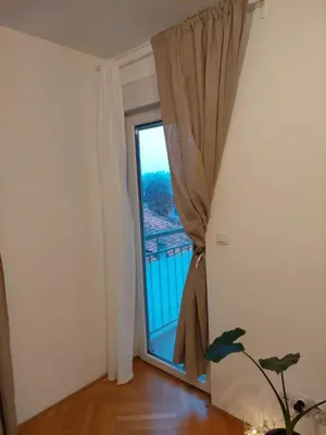 a room with a window with a view of a balcony at Jana's in Belgrade