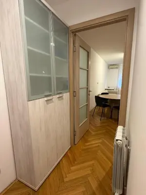a door leading to a room with a table at Jana's in Belgrade