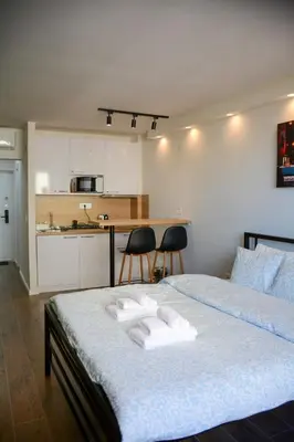 a bedroom with a bed with two towels on it at LUX apartment 15 min walk to Knez Mihajlova in Belgrade