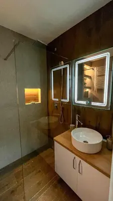 a bathroom with a sink and a glass shower at LUX apartment 15 min walk to Knez Mihajlova in Belgrade