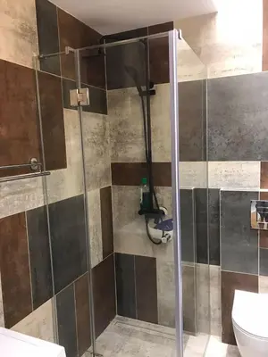 a shower with a glass door in a bathroom at Visnjica in Belgrade