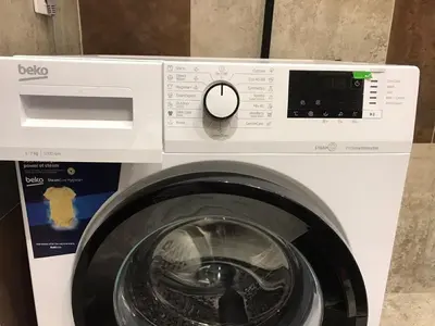 a white washing machine with a washer at Visnjica in Belgrade