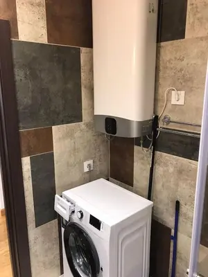 a washer and dryer in a small bathroom at Visnjica in Belgrade