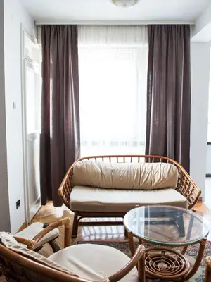 a living room with a couch and a glass table at Apartment Marshall Resavska in Belgrade