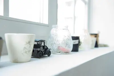 a toy truck sitting on a shelf next to a vase at Apartment Marshall Resavska in Belgrade