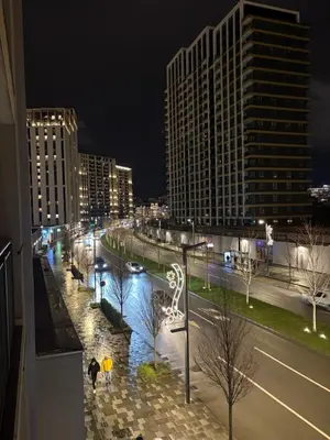 a view of a city at night with buildings at Solis BW Apartments in Belgrade