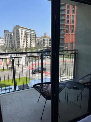 a balcony with chairs and a view of a street at Solis BW Apartments in Belgrade