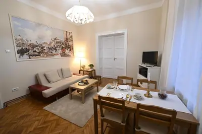 a living room with a couch and a table at La Mascarade in Belgrade