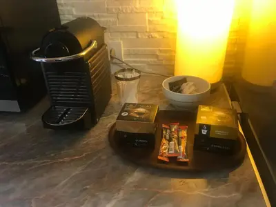 a table with boxes of food and a microwave at Apartment Akacija Gardens in Belgrade
