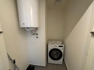 a washer and dryer in a small room at BW Echo Lux Apartment - Belegrade Waterfront in Belgrade