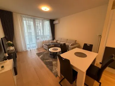a living room with a table and a couch at BW Echo Lux Apartment - Belegrade Waterfront in Belgrade