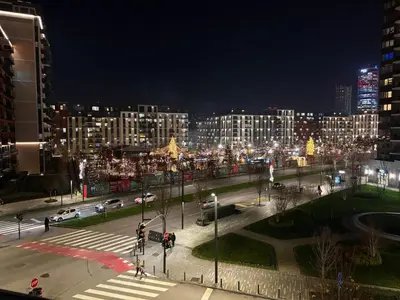 a view of a city at night with lights at Lunalux BW Apartments in Belgrade