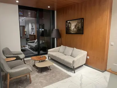 a living room with a couch and two chairs at Lunalux BW Apartments in Belgrade