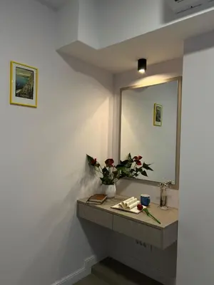 a bathroom with a sink and a mirror at Sovica- Taš in Belgrade