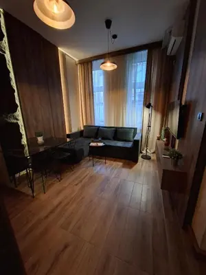 a living room with a couch and a table at Premium City Center TOP LOCATION apartments in Belgrade
