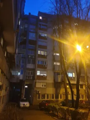 an apartment building at night with a street light at VukTas in Belgrade