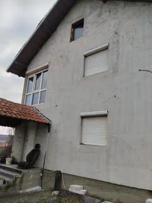 a man sitting on the steps of a house at Spring Hill in Belgrade
