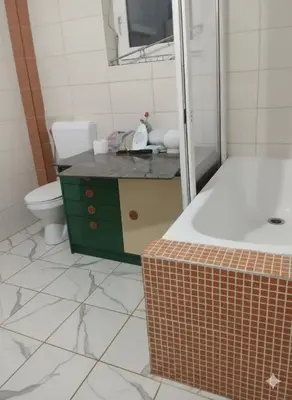 a bathroom with a sink and a toilet and a tub at Spring Hill in Belgrade