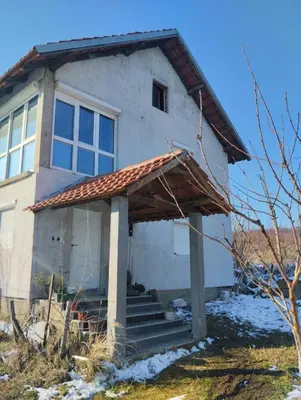 a house with a porch and stairs in front of it at Spring Hill in Belgrade