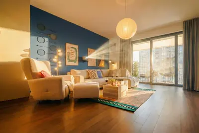 a living room with a couch and a chair at WF 104m2 Prestige with Terrace, Gym and Pool in Belgrade