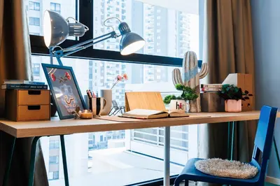a desk with a lamp and a window at WF 104m2 Prestige with Terrace, Gym and Pool in Belgrade
