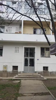 a white building with a door in front of it at Signorina in Smederevo