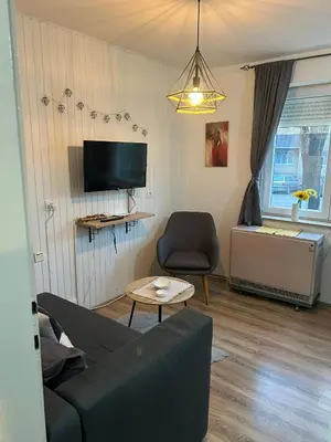 a living room with a couch and a chair at Apartman Borkica in Mladenovac
