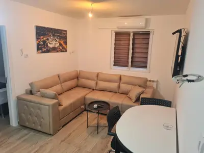 a living room with a couch and a table at Marash 3 in Belgrade