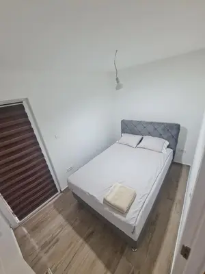 a small bedroom with a bed in a room at Marash 3 in Belgrade