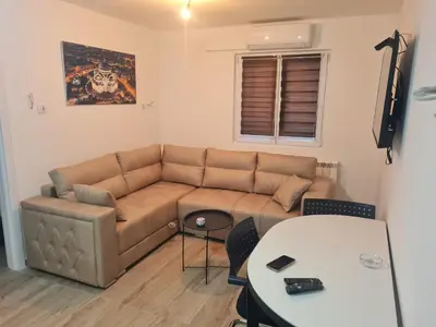 a living room with a couch and a table at Marash 3 in Belgrade