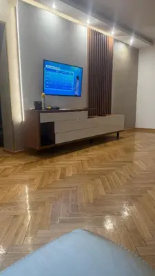 a living room with a large flat screen tv on a wall at vila filip in Belgrade
