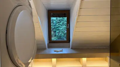 a hallway with a window and a shoe on the floor at vila filip in Belgrade