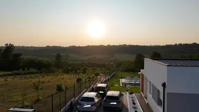 a row of cars parked in a parking lot at Casa Toleni in Ba°evac
