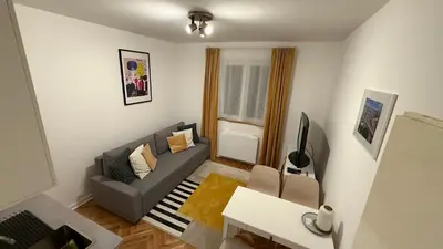 a living room with a couch and a table at GardosHouse Apt 2 in Belgrade