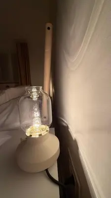 a lamp on a table next to a bed at GardosHouse Apt 2 in Belgrade