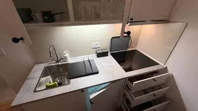 a small kitchen with a sink and a counter at GardosHouse Apt 2 in Belgrade