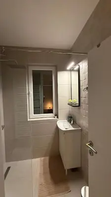 a bathroom with a sink and a mirror at GardosHouse Apt 3 in Belgrade