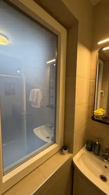a bathroom with a shower and a sink and a tub at GardosHouse Apt 3 in Belgrade
