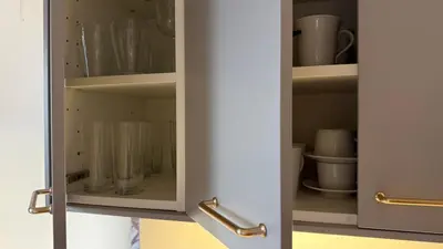 a cupboard with cups and glasses in it at GardosHouse Apt 4 in Belgrade