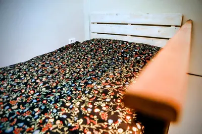 a bed with a bunch of shoes on it at Old Port Riverside Lofts in City Center in Belgrade