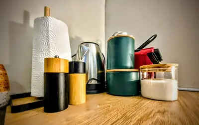 a counter top with several different colored thermos on it at Old Port Riverside Lofts in City Center in Belgrade