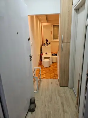 a hallway leading to a living room with a kitchen at Aker in Belgrade