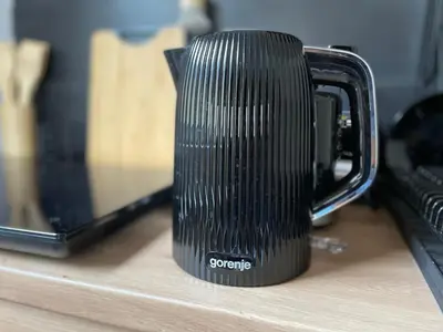 a black coffee mug sitting on a counter at Dolce Vita in Belgrade