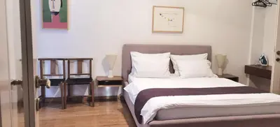 a bedroom with a large bed with white pillows at One Bedroom Apartment Theatre in Belgrade