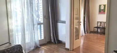 a room with a door and a window with curtains at One Bedroom Apartment Theatre in Belgrade