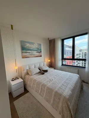 a bedroom with a large bed and a large window at Belgrade Waterfront Quartet 3 in Belgrade